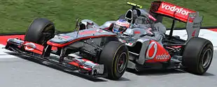 Photographie de Jenson Button dans le cockpit de sa monoplace