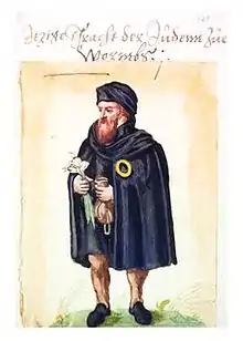 Dessin en couleur représentant un homme barbu portant la rouelle sur son manteau.