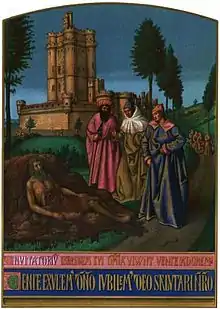 Trois personnages debout devant un autre allongé le long d'un chemin devant un donjon imposant.