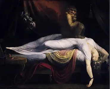 Tableau d'une femme, portant une robe de nuit blanche, en train de rêver. Elle est couchée sur un lit les bras alanguis. Un lutin grotesque est assis sur sa poitrine.