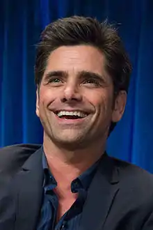 John Stamos dans le rôle de Brock.