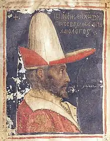 Photographie de profil du portrait d'un homme portant un chapeau