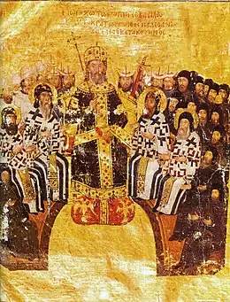 illustration ancienne sur fond doré : un homme couronné en majesté entouré de personnes assises