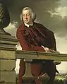 Homme se reposant sur l'accoudoir d'une balustrade
