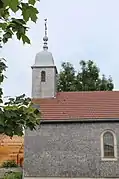 La chapelle Saint-Claude à Jougne Jura aux murs et clocher recouverts de tavaillons.