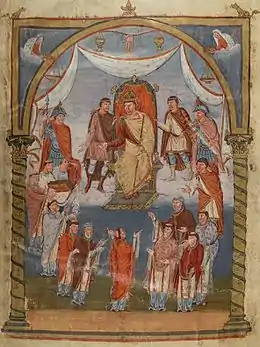 Peinture médiévale. Au centre en haut un roi portant couronne est assis sur son trône. Autour de lui, une quinzaine d'hommes, certains étant visiblement des moines : ils sont tonsurés.