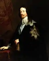 Charles Ier porte une veste noire avec un grand emblème de l'ordre de la Jarretière sur l'épaule