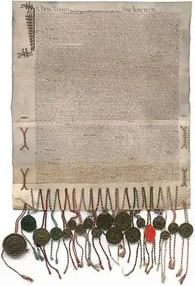 Charte manuscrite sur 2 pièces de parchemin cousues ensemble et portant des sceaux en cire
