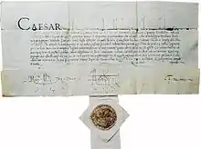 Photo d'un courrier manuscrit au bas duquel est fixé un sceau en cire.