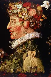 Tête composée de fleurs roses (visage), blanches (fraise), multicolores (chapeau) et de feuillages (pourpoint)
