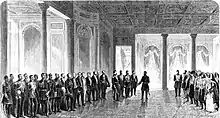 Jean Alexandre Cuza entouré de deux haies de dignitaires avance dans une salle du palais