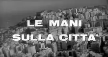 Description de l'image Le mani sulla città.png.