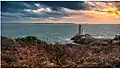 Le soleil d'hiver embrase les nuages au-dessus du phare du Petit Minou