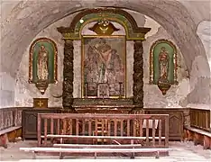 Le retable tridentin de la chapelle de Sainte-Florine dégradé en 2012.