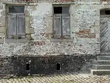 Photographie montrant une maison de mulquinier à Ligny
