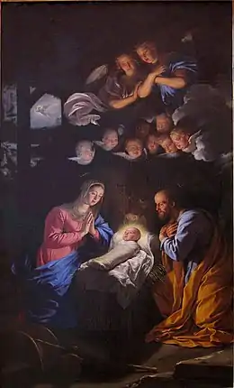 Dans une étable, Marie, les mains jointes, et Joseph, les mains croisées, regardent l'enfant Jésus emmailloté dans son berceau, sous le regard de deux anges et de huit angelots
