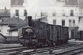Un train quitte la gare de Vesoul, tracté par la Corpet-Louvet 030T no 31.