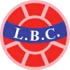 Logo rond avec l'inscription « LBC » sur un bandeau bleu clair au centre d'un ballon de football rouge-orange.
