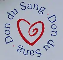 Logo représentant un cœur stylisé entouré des mots « Don du sang. »