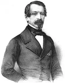 Gravure d'un homme avec un bouc et une moustache cintré dans une veste noire