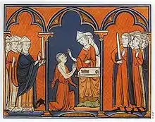 Enluminure montrant Louis agenouillé, en position de prière, devant un évêque qui le oint. Les prélat du royaume sont présents à gauche, les seigneurs à droite.