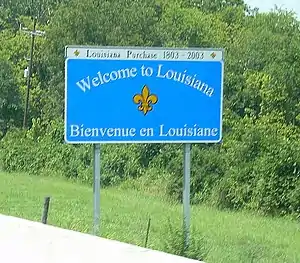 Panneau routier bilingue à l'entrée de la Louisiane.