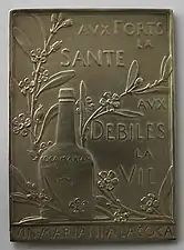 « Aux forts la santé, aux débiles la vie », plaque d'Oscar Roty pour le vin Mariani à la coca.