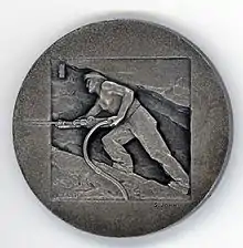 Photographie du verso de la médaille commémorative remise aux mineurs pour le centenaire des mines de Montevecchio