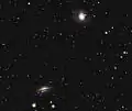 Photographie de NGC 1055 et de M77 réalisée par un astronome amateur.