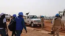 soldats de l'ONU et quelques pick-up armés