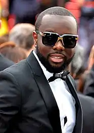 Maître Gims, chanteur congolais.