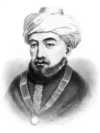 Gravure en noir et blanc représentant un homme barbu en turban portant une décoration autour de son cou.