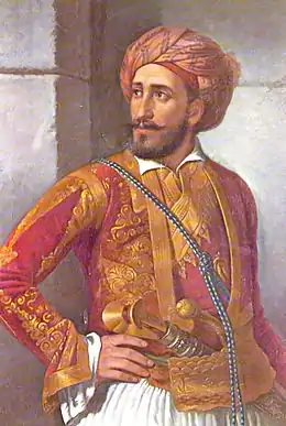 portrait d'homme barbu en veste rouge et or, portant un turban