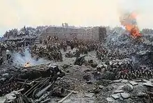 Des centaines de soldats défendent une tour partiellement détruite