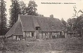 Vieille chaumière à colombages et toit de chaume. (carte postale vers 1920)