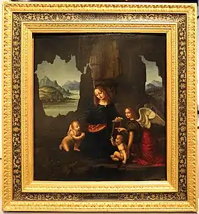 Tableau en couleur. Dans un cadre de rochers, une femme est entourée de deux bébés nus. L'un est agenouillé l'autre est assis. Un personnage habillé et ailé regarde l'observateur et désigne le bébé de gauche du doigt.