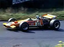 Bruce McLaren pilotant une de ses monoplaces au Grand Prix d'Allemagne 1969.