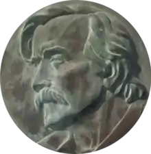 Description de l'image Medalhão com busto de José Rodrigues Miguéis (Cemitério do Alto de São João, Lisboa).png.