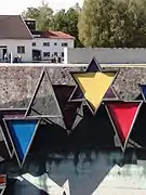 Various badges on a Dachau memorial