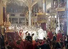 Debout sur une estrade, le roi de Prusse portant une couronne et revêtu d'un long manteau rouge est entouré de nombreux membres du gotha : des dames en crinolines claires et des hommes en uniformes