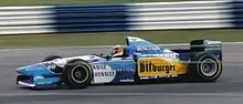 Photo de Michael Schumacher au volant de sa Benetton B195 lors du Grand Prix de Grande-Bretagne.