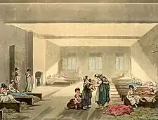  À cette époque, les mendiants autour de Londres pouvaient être appréhendés par les autorités et être emprisonnés pendant sept jours avant d'être renvoyés dans leur région d'origine. Ackermann représente ici la salle utilisée pour les femmes indigentes.