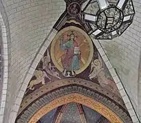 Photographie en couleurs d'une fresque représentant une scène religieuse peinte sur une voûte.