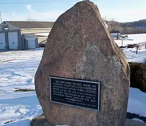 Granite stone standing in snow covered lawn. aluminum plaque on face of stone, raised letters read "This stone marks the spot where the confederate raider John H. Morgan surrendered his command to Maj. George W. Rue July 26, 1863 and is the farthest point north ever reached by any body of Confederate troops during the Civil War.  Erected by Will W. Thompson East Liverpool, Ohio1909"