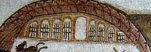 Vue de neuf ouvertures dont huit sont munies de grilles et d'une partie supérieure d'un édifice.