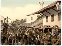 Photographie en couleur d'un quartier turc de Mostar (Bosnie) en 1900.