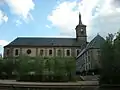 Façade nord de l'abbatiale avec les jardins Humbert Belhomme