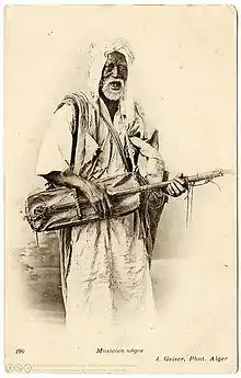 Gnaoui d'Alger avec son guembri (vers 1906), par Jean Geiser (1848-1923)