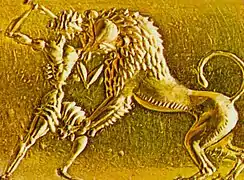 Homme combattant un lion, relief en creux sur une bague mycénienne en or, Grèce, XVIe siècle av. J.-C.