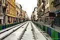 Image représentant l'avenue de la République en travaux avec les rails posés.